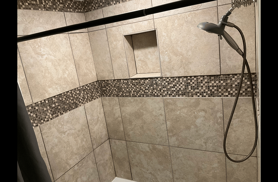 Standard Suite's Private Bath with Ceramic Tub and Full Tile Surround.