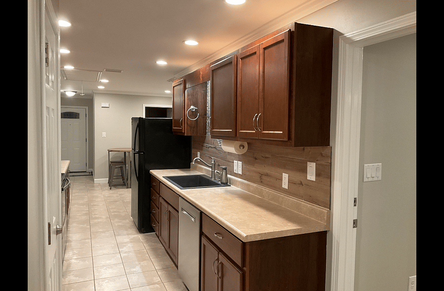 Expansive Galley Kitchen in Shared Common Area. Each of the Suites have a designated upper and lower cabinet for storage of personal food items.