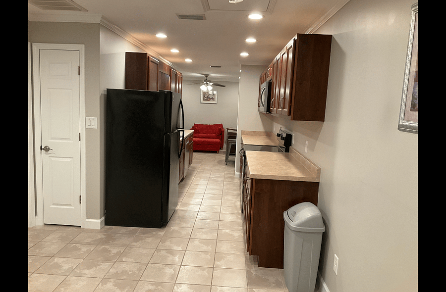 Expansive Galley Kitchen in Shared Common Area. Each of the Suites have a designated upper and lower cabinet for storage of personal food items.