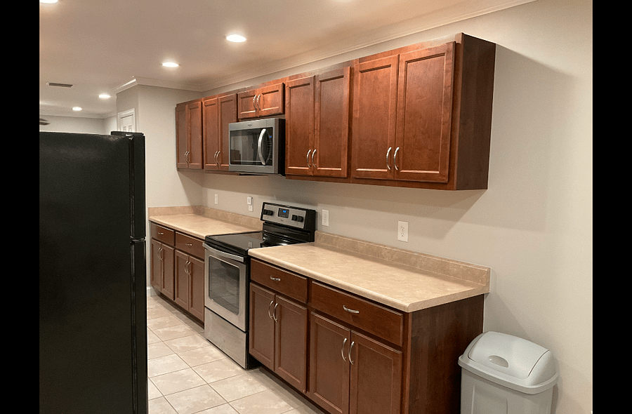 Expansive Galley Kitchen in Shared Common Area. Each of the Suites have a designated upper and lower cabinet for storage of personal food items.