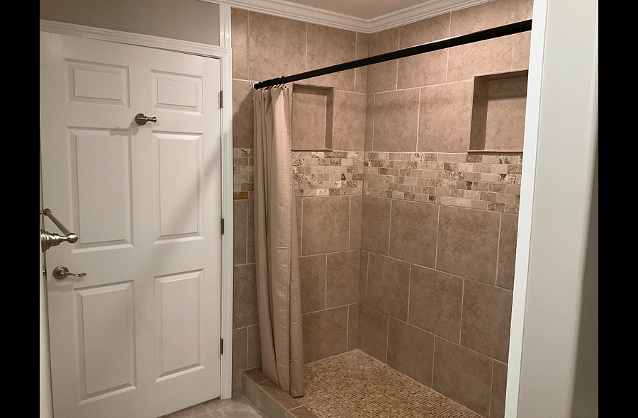 Expanded Luxury Suite's Private Bath with Oversized, Fully Tiled, Walk-in Shower.