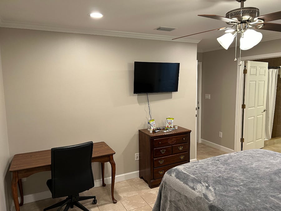 Expanded Luxury Suite: bed, bedside table, sitting chair, dresser, desk and office chair, WiFi TV. Private bathroom. Oversized Walk-in Shower. Huge Walk-in Closet. Private Entrance.