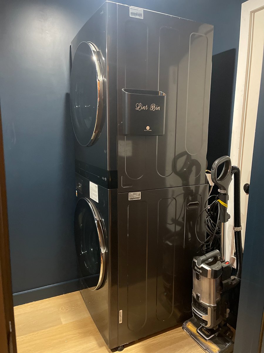 Downstairs laundry room with new washer/dryer and folding area.