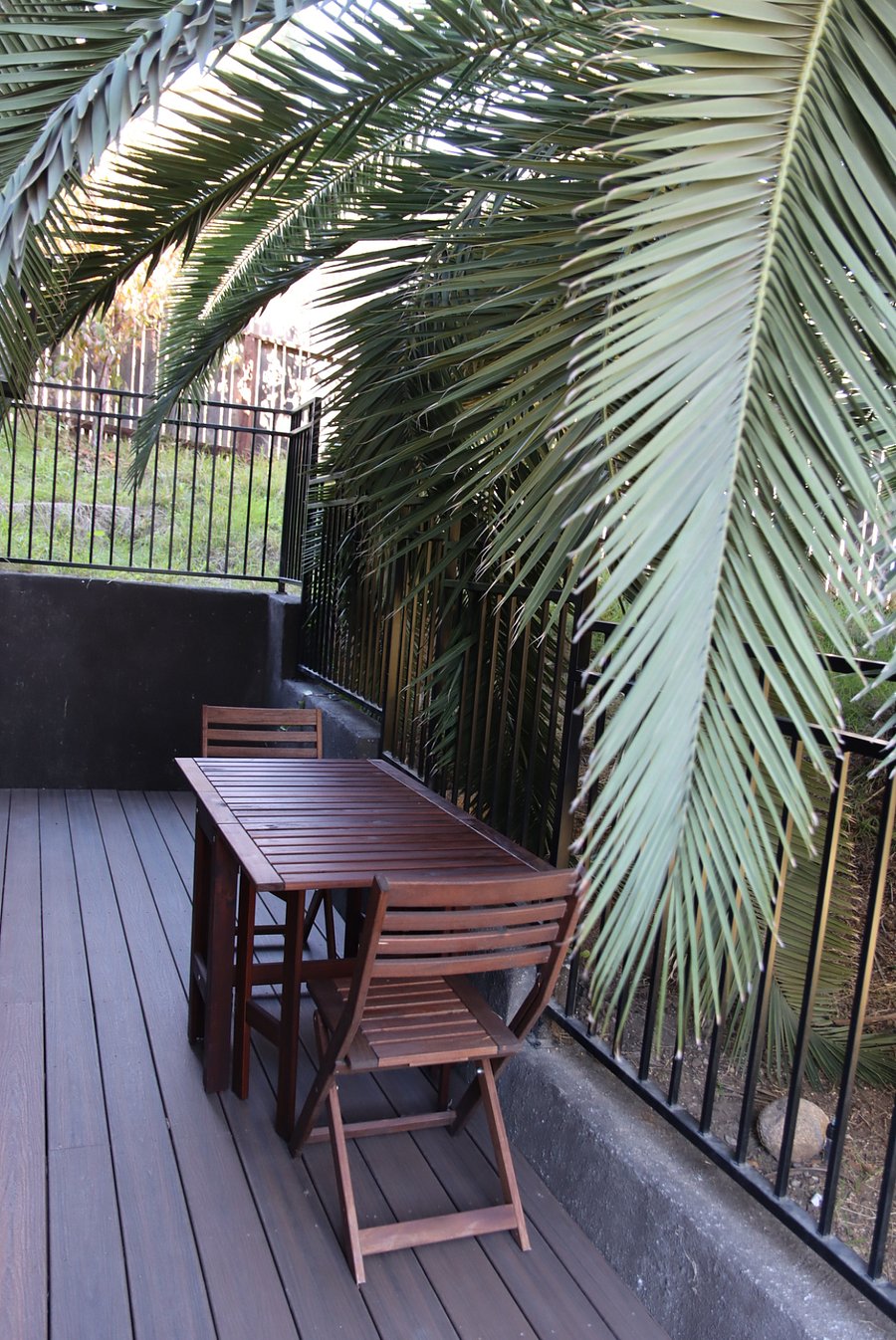 Private deck with table and chairs to enjoy a morning coffee outside.