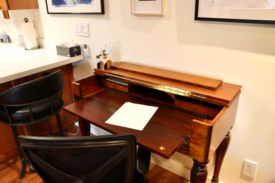 This desk is a good size for a laptop and closes up when you dont need it.