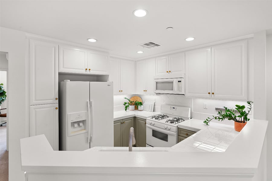 Kitchen with kitchen essentials (pots, pans, plates, cups, utensils etc)