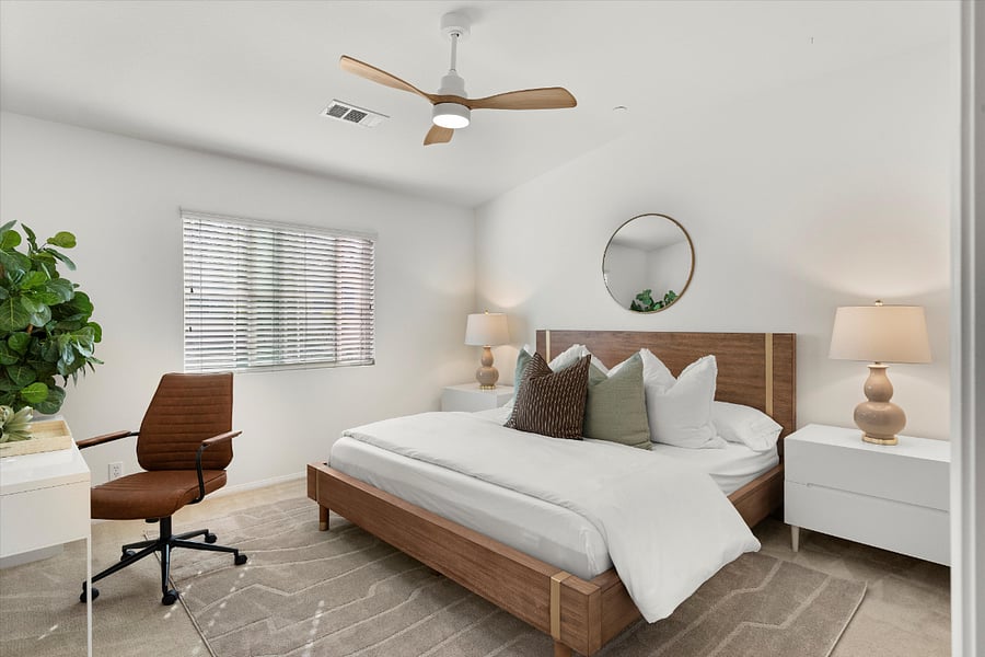 Primary bedroom with King size bed and dedicated work desk.