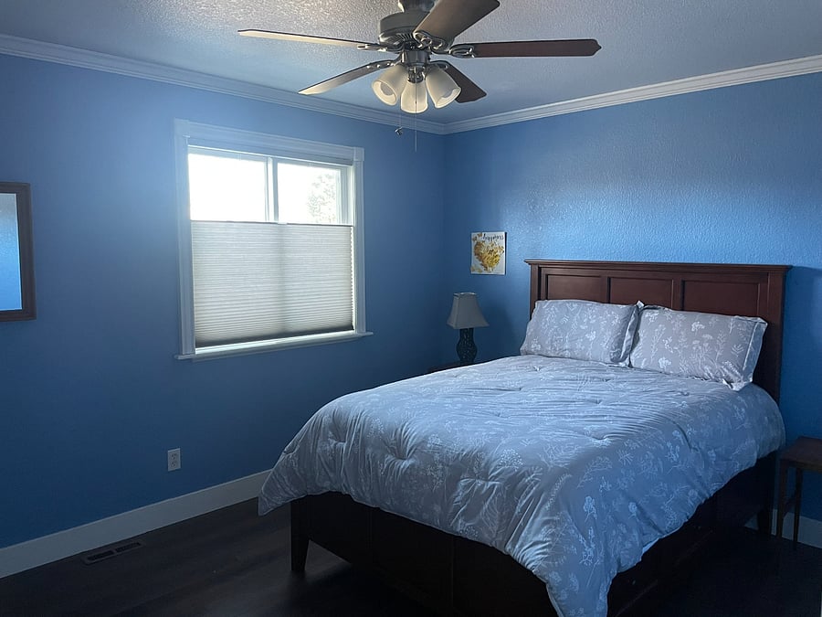 Bedroom 2: Upstairs bedroom with full-sized bed and Hunter Douglas top-down bottom-up shades. Bed has 6 storage drawers in addition to the closet space.