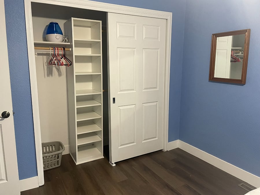 Bedroom 2: Upstairs bedroom with full-sized bed and closet. Bed has 6 storage drawers in addition to the closet space.