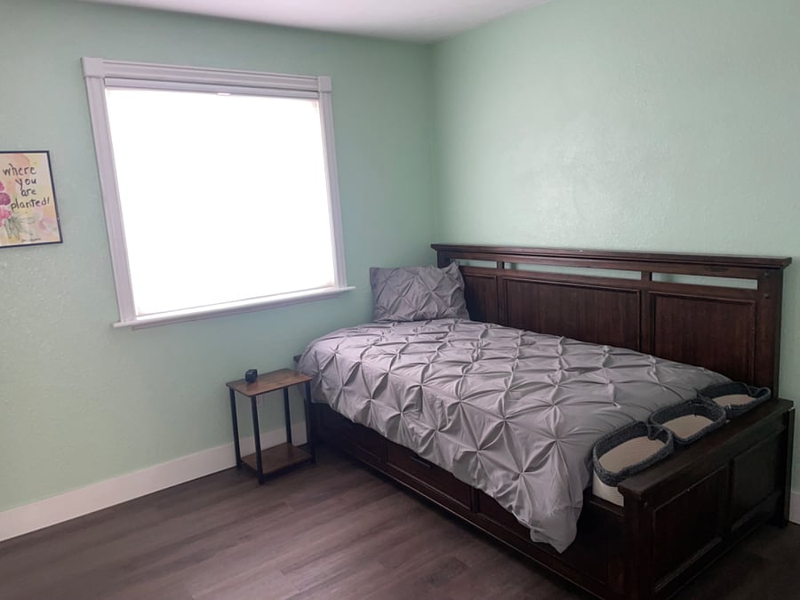 Bedroom 4: Downstairs bedroom with twin bed. Storage drawers in bed and closet.