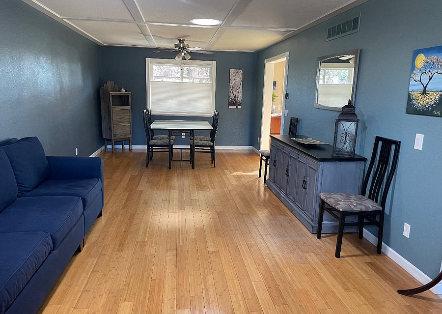 Main-level Living Room and Dining Room. Table will fit 6 comfortably. Additional chairs available.