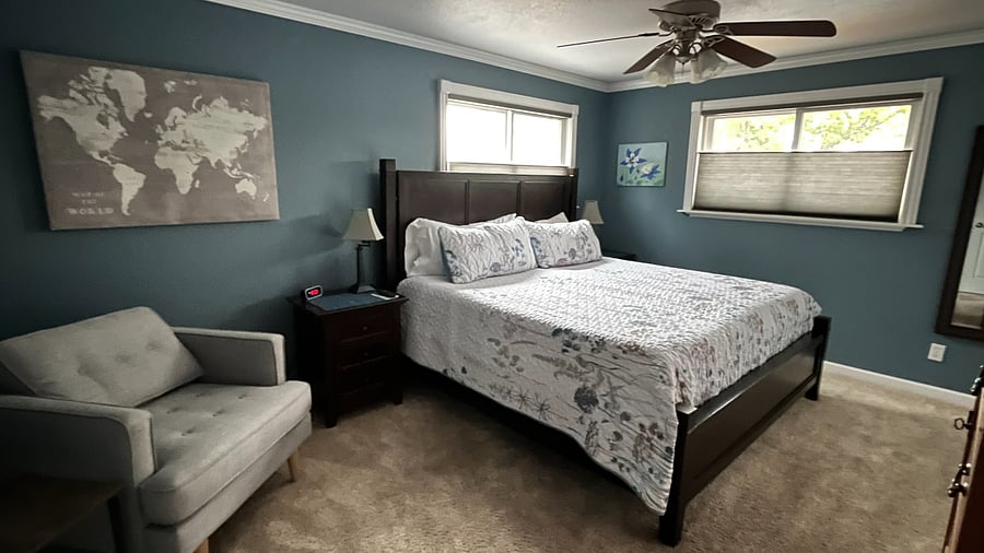 Bedroom 1: Primary Bedroom with King-sized bed. Hunter Douglas top-down bottom-up cordless shades.
