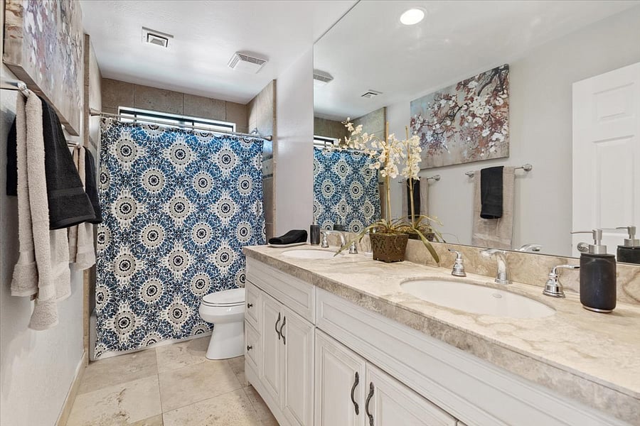 Upstairs bathroom with tub, shower, dual sinks.  100% cotton towels. 