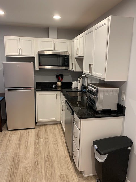Kitchenette with new stainless-steel appliances and coffee maker. Kitchenware available (utensils, plates, cups, glasses, etc.)