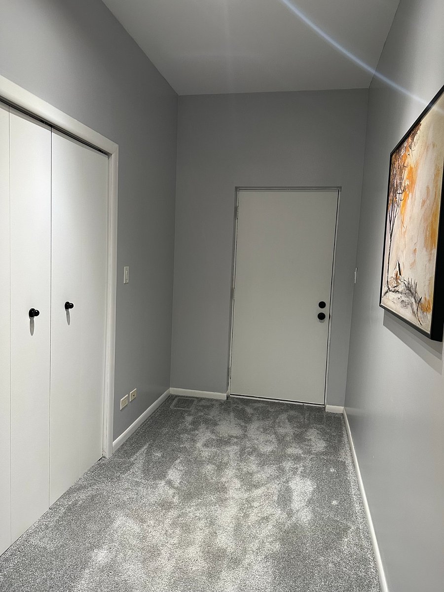 Large hall closet and door to balcony
