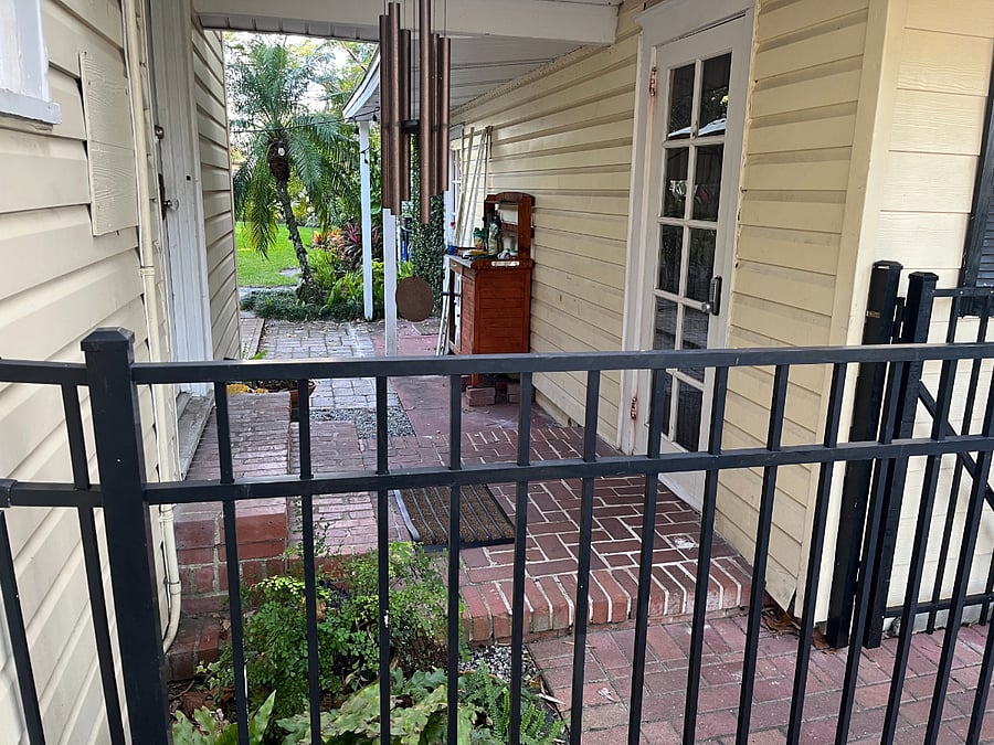 The cottage is connected to the main house by this breezeway. It has its own private entrance to the right and the entrance to the main house is on the right. When guests are here we dont use this door but enter our house through the front door.This