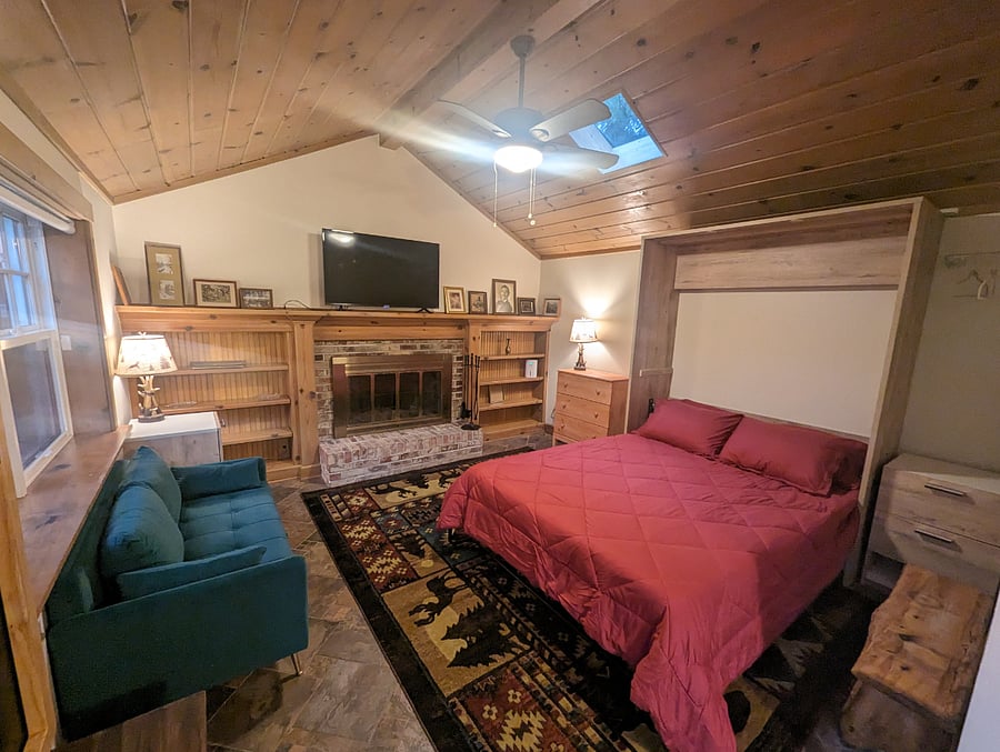 Main living space with queen murphy bed