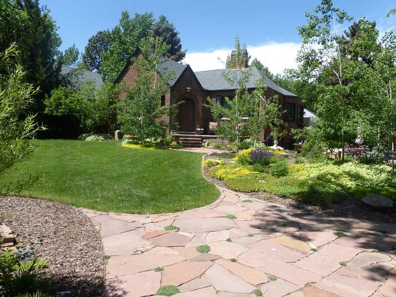 Front of 1935 Brick Tudor house with beautiful double lot yard