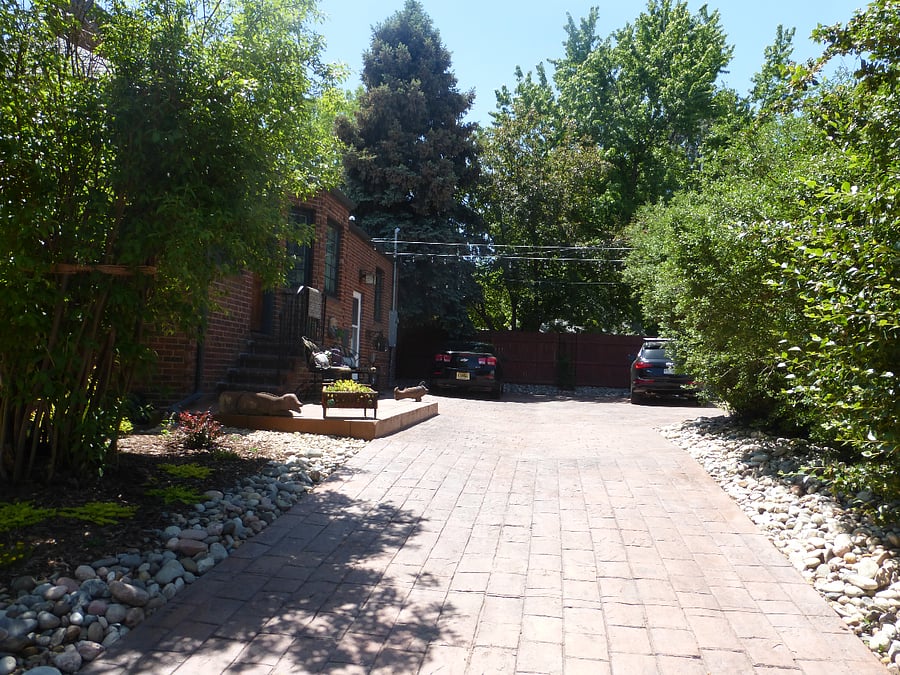 Driveway with one assigned off-street parking space for compact to mid-size vehicle