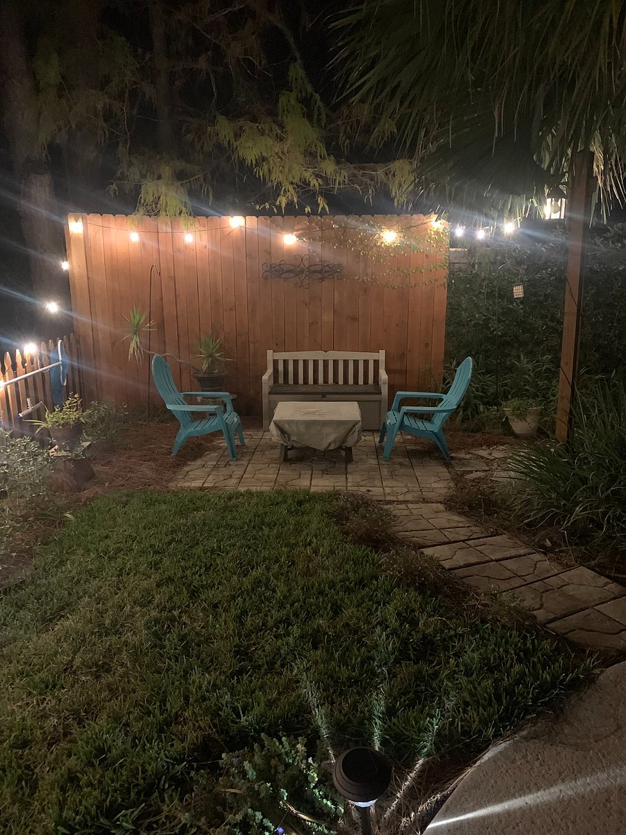 String lights surround the back for a warm night setting