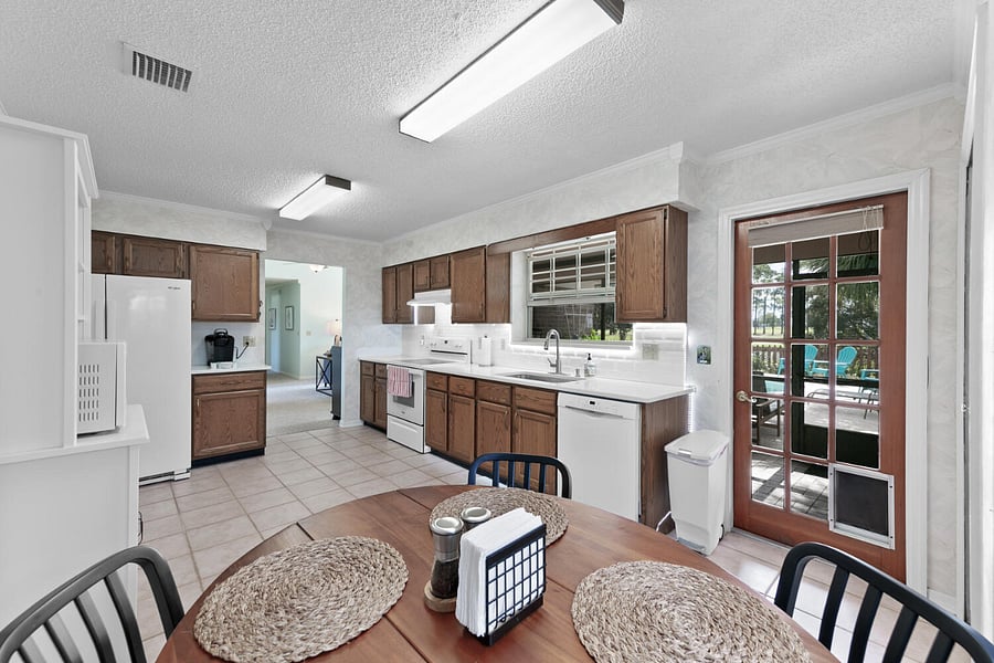 Fully stocked kitchen includes Keurig (drip coffee machine and burr grinder is stored in the pantry if you'd like), toaster oven, full utensil sets, pots & pans, glasses, cooking dishes, spices, etc
