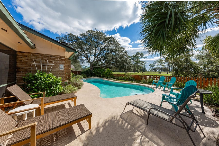 The Florida sun requires some pool time and leisure. An outdoor gas grill is located right off to the side.