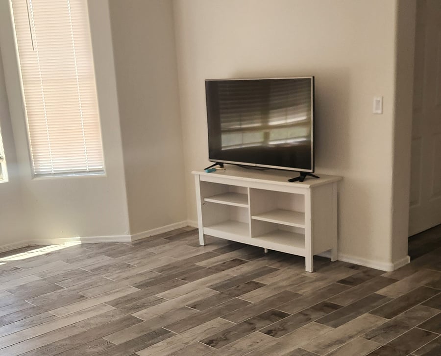 separate living room area with large TV and chaise lounge for your use