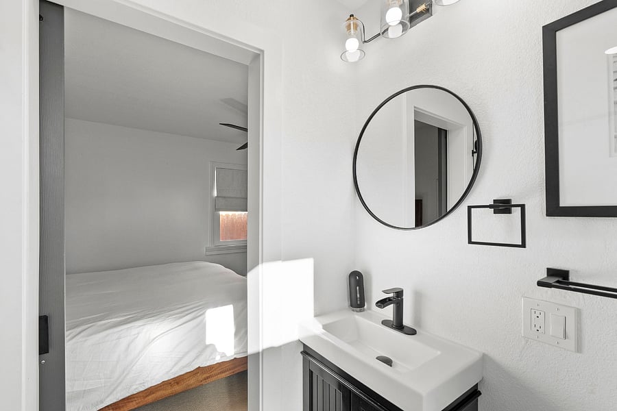 Ensuite Bathroom to the Primary Bedroom.  It has a tub with a shower in it. 