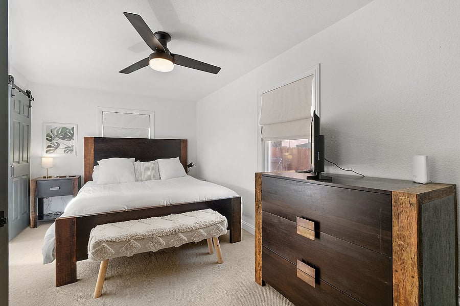 Primary Bedroom with a CA King bed, TV and an ensuite bathroom (tub and shower)
