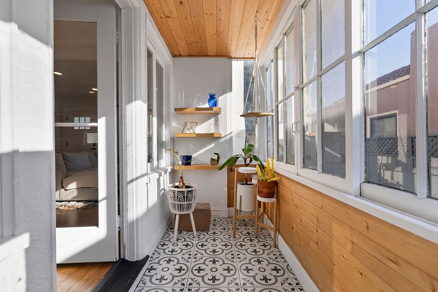 Sunroom, great for storing suitcases or for those with a green thumb.