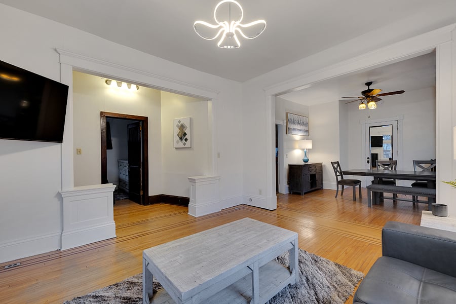 Living room looking into dining area , coffee table that folds into a desk