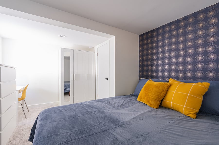 Bedroom view of 6 drawer dresser, desk and built in wardrobe. Add this chair to the 3 in living room to provide dining seating for 4 at your next dinner party.