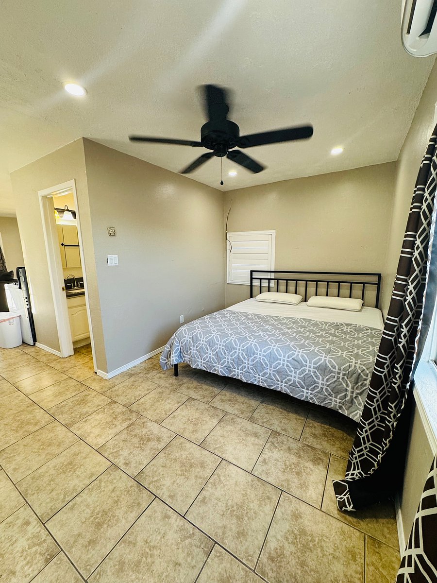 King size bed with blackout curtains in bedroom and mini split ac and heater. Ceiling fan added for comfort and dimmable lights 