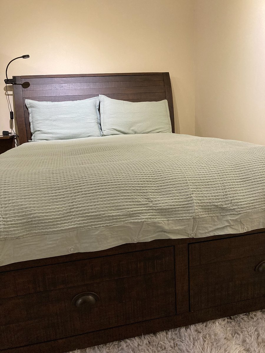 There are two deep drawers at the foot of the bed.