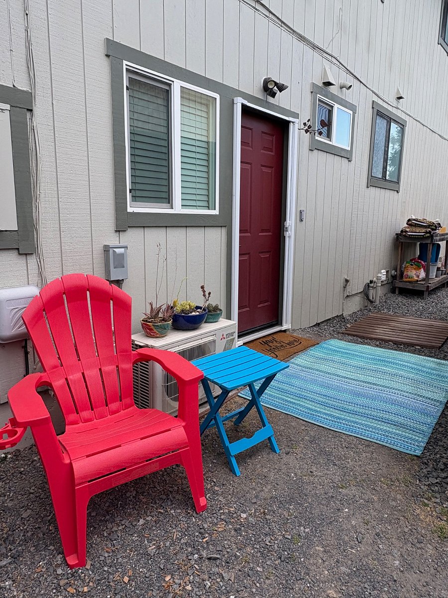 The view from just inside the gate. The red door opens into your studio.