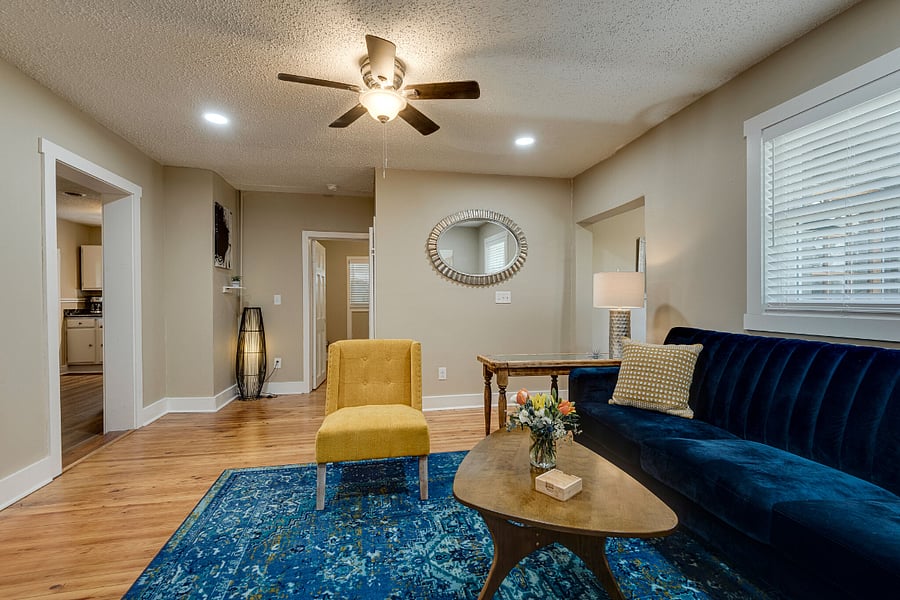 Refinished Hardwood Floors ?Living Room towards Smaller Bedroom and Kitchen