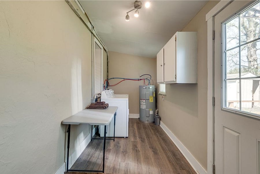 Separate Laundry Room. Washer/Dryer and Folding Table included