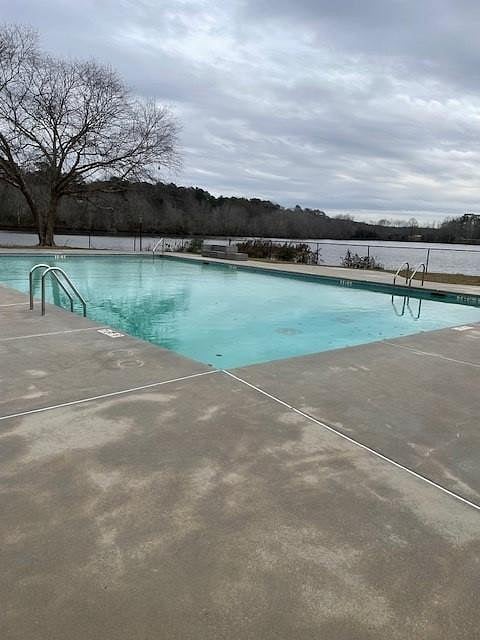 Community swimming pool and lake for canoeing