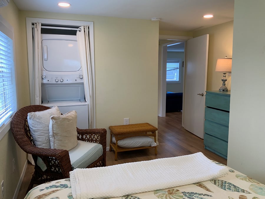 Primary bedroom with washer and dryer