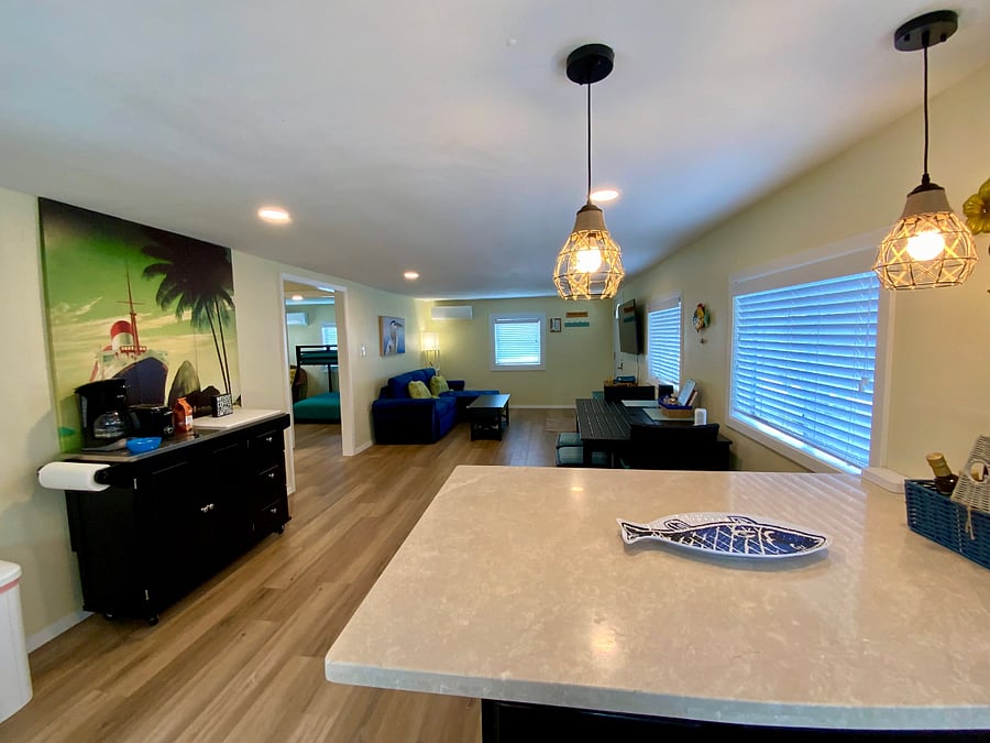 Pendant lights over breakfast island! Coffee bar, toaster, all the necessities for the morning!