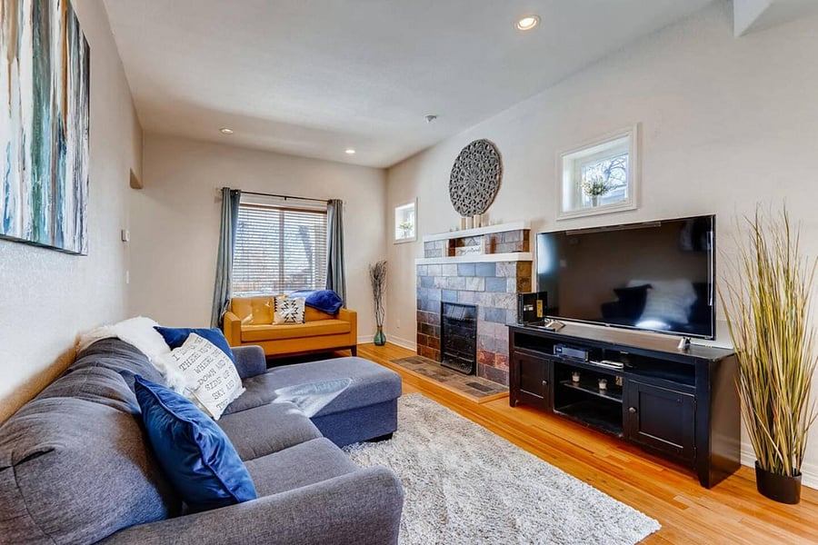 Well Designed Living Room with, Recently Restored Original Hardwood Floors, Beautiful Art, Plants, and a 55" 4K LED Smart TV with Cable, HBO, Roku and Netflix.