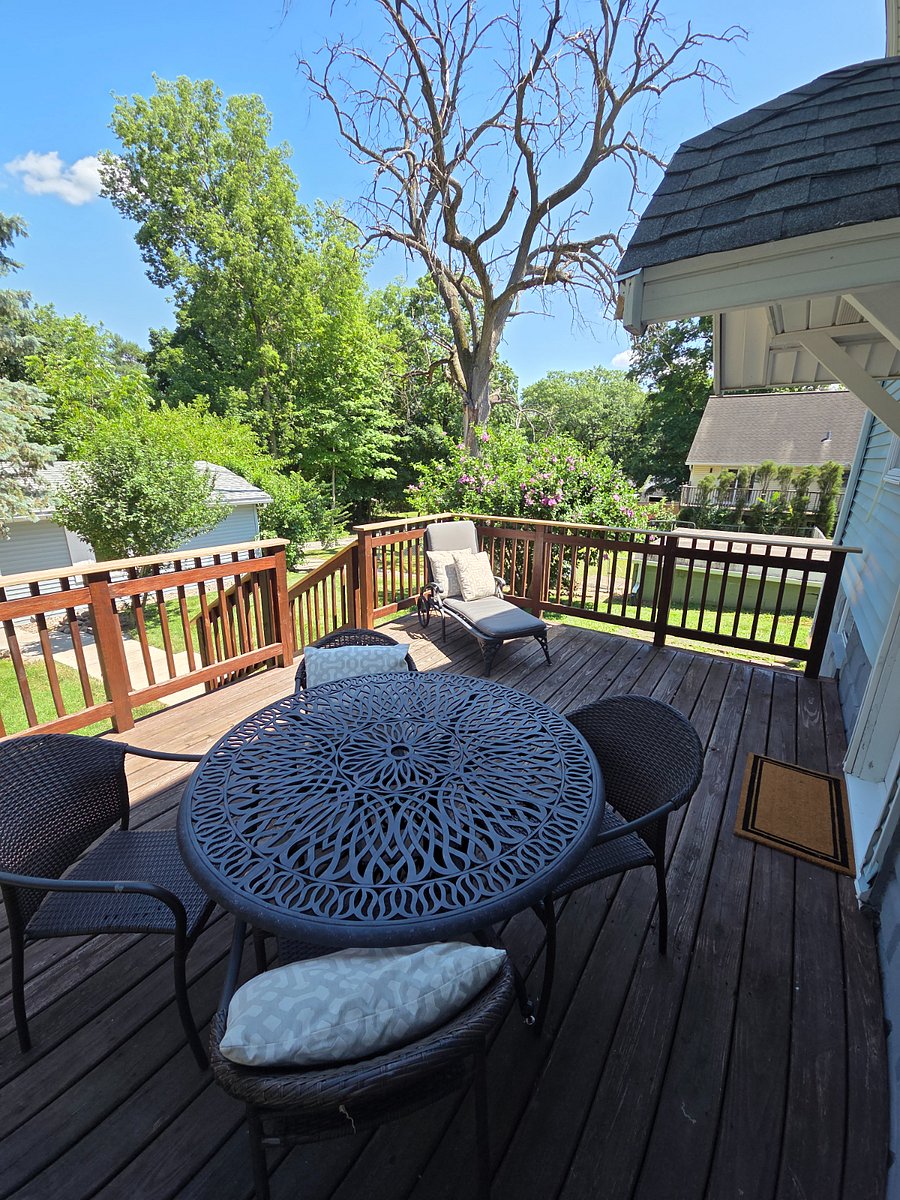Large deck for outdoor enjoyment accessed by back door.  Walkway to garage. 