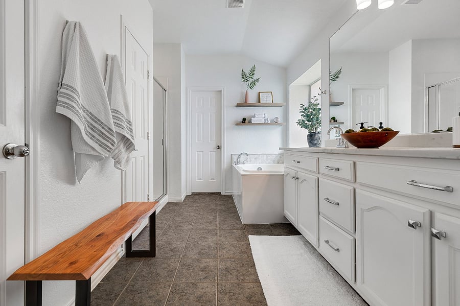 Master en-suite bath with soaking tub, standing shower, walk-in closet, linen closet and ample storage.