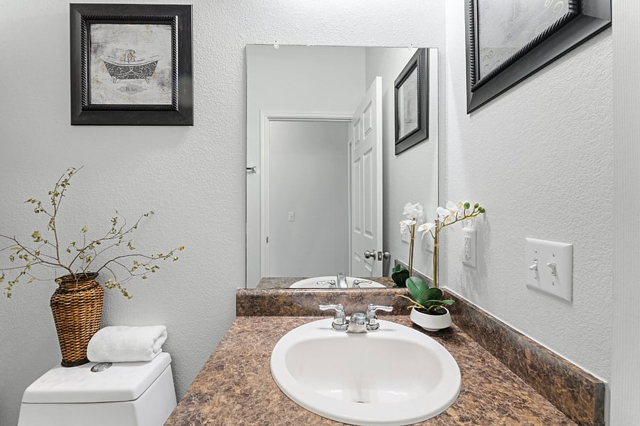 Shared guest bathroom with tub and shower.