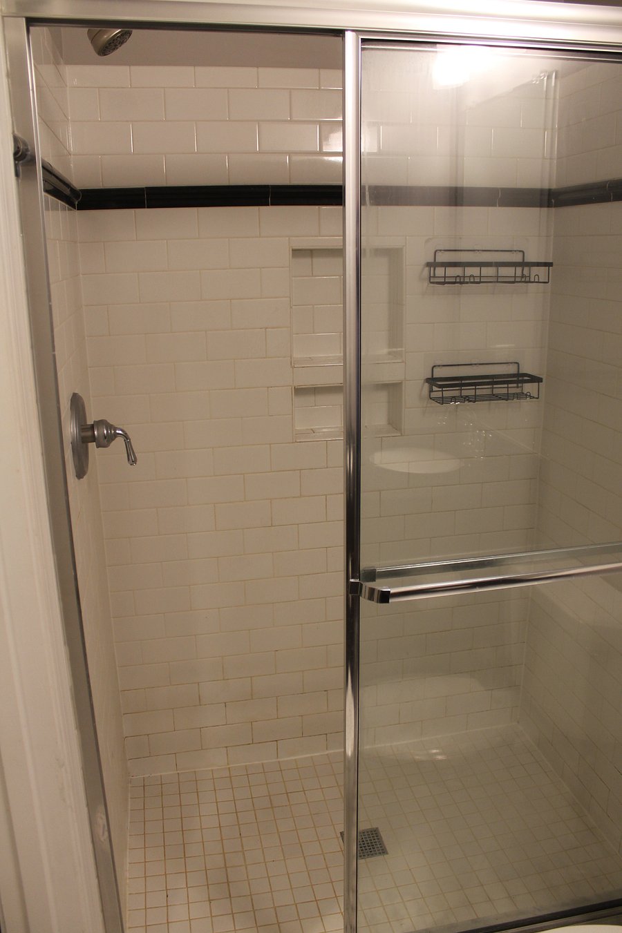 Second bedroom private bathroom with walk in shower. 