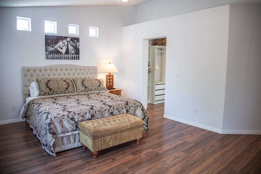 Your primary bedroom has a king-size bed and lot of windows for natural light!  (Black-out curtains on the window and patio slider.)