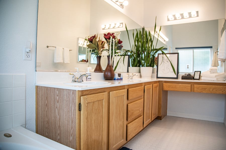 Primary bathroom has 2 sinks and a vanity for applying make-up.