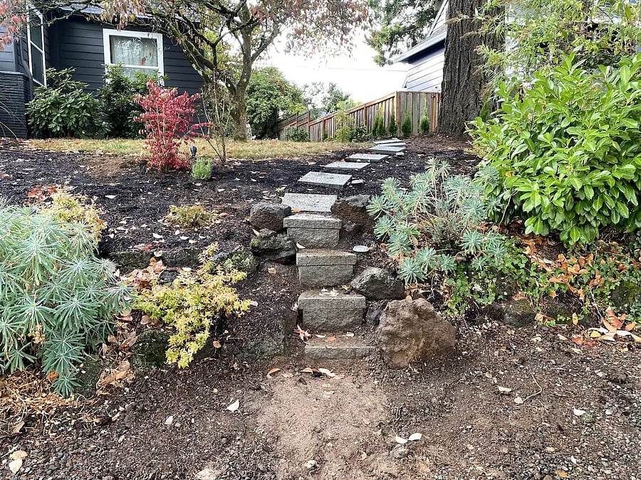 Steps up from street to the back of the property
