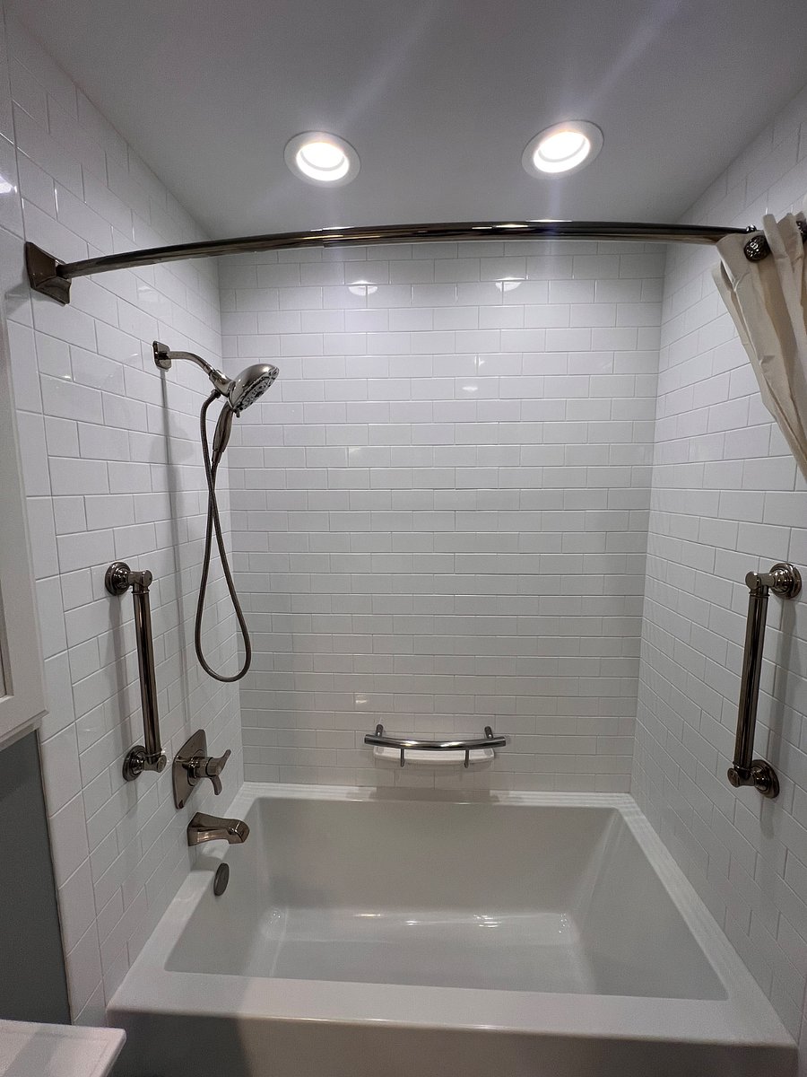 Remodeled bathroom upstairs with deep soaking tub.