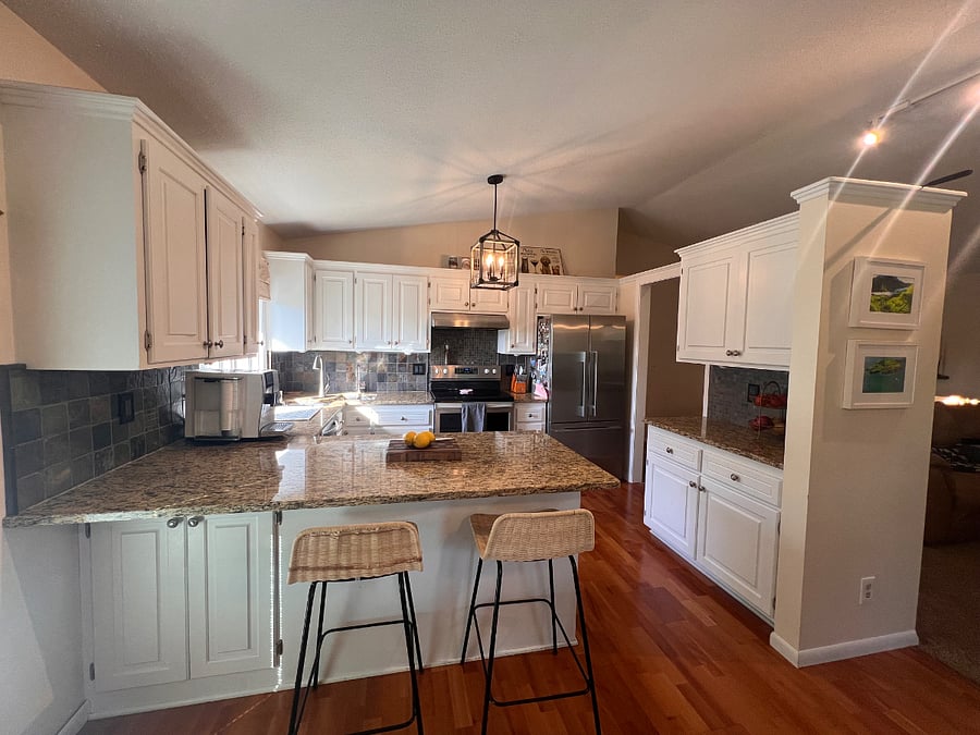 Beautiful upstairs kitchen opens to dining room and living room with vaulted ceilings and lake views.
Refinished cabinetry, SS appliances
